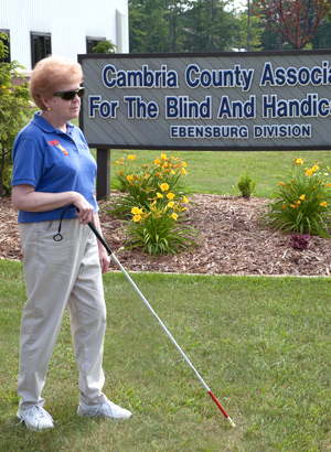 Person using white cane 