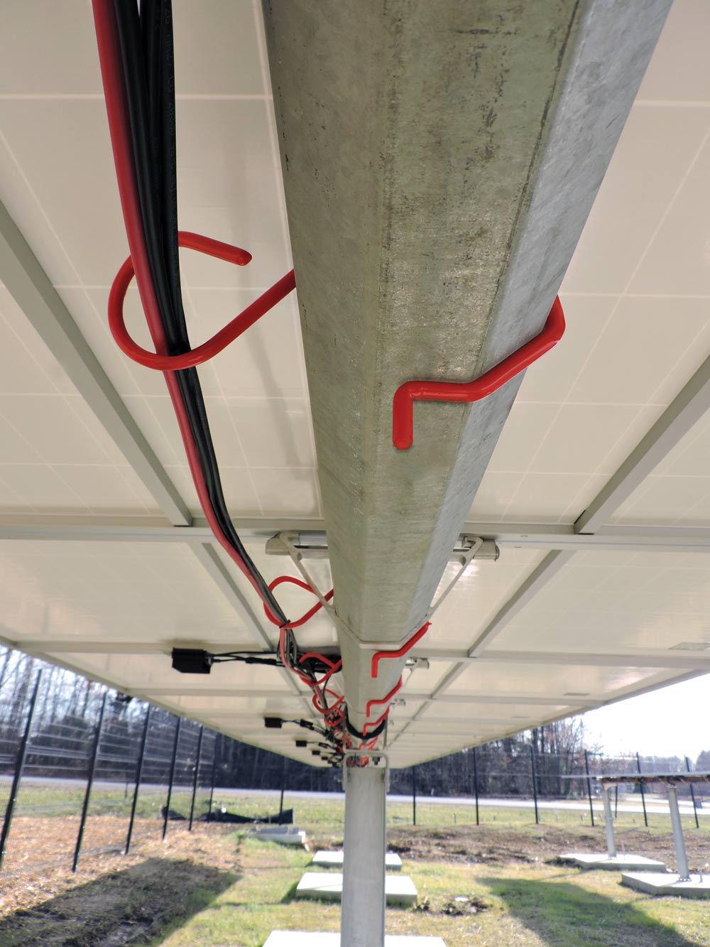 CAB Solar Torque Tube Hangers Safely Organize Under-Panel Wiring